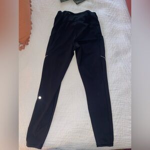 Lululemon Athletica Black leggings with side pockets and back zipper